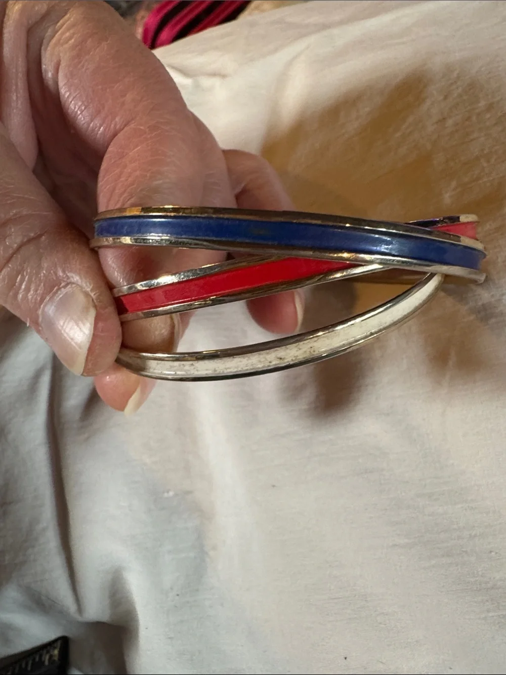 Napier Interlocked Goldtone Bangles with Red, White, and Blue Enamel Accents
